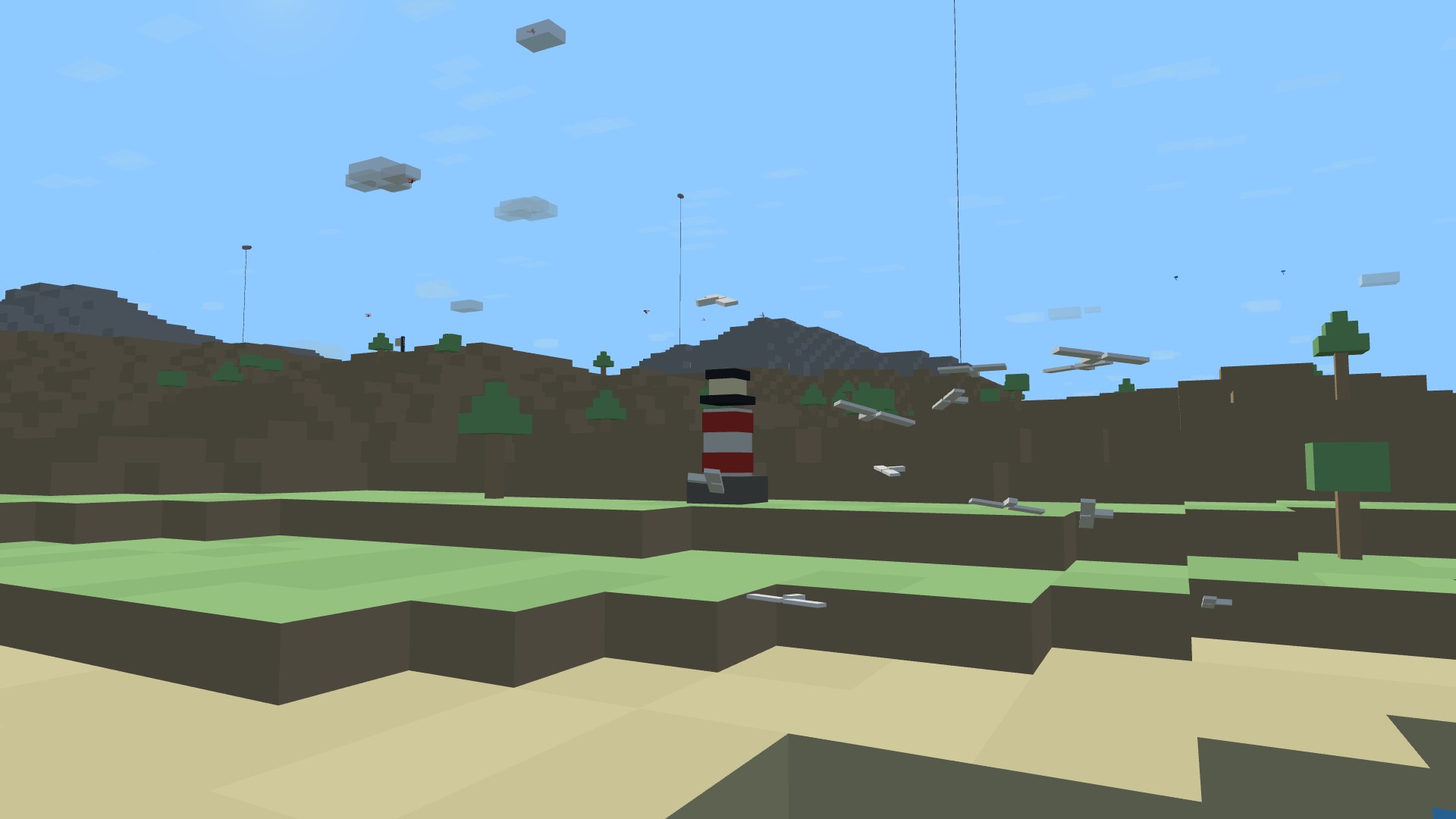 The striped coastal lighthouse by day with a whole flock of gulls wheeling around it over the shore
