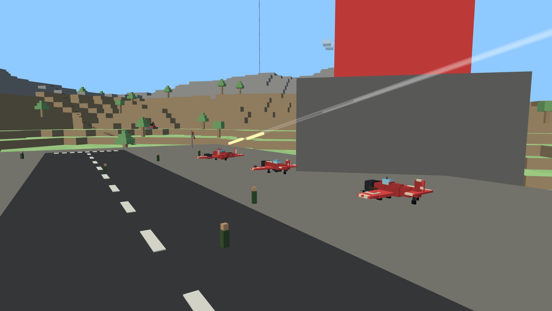 A row of parked reserve fighters sitting on their wheels on the grass beside a team's home tower, an enemy fighter rolling in on them with a stream of tracer